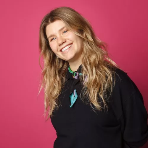 Blonde woman, laughing into the Camera
