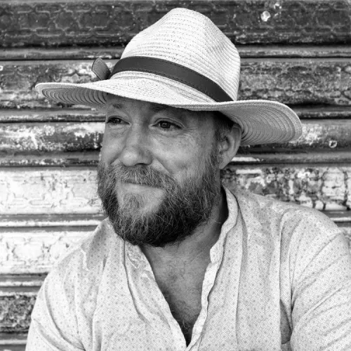 picture of Jay Cousins looking super kind and handsome and wearing a hat ;)
